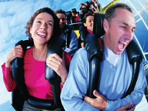 man and woman riding roller coaster